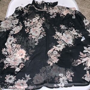 Sheer floral blouse with ruffle neck and at shoulder
